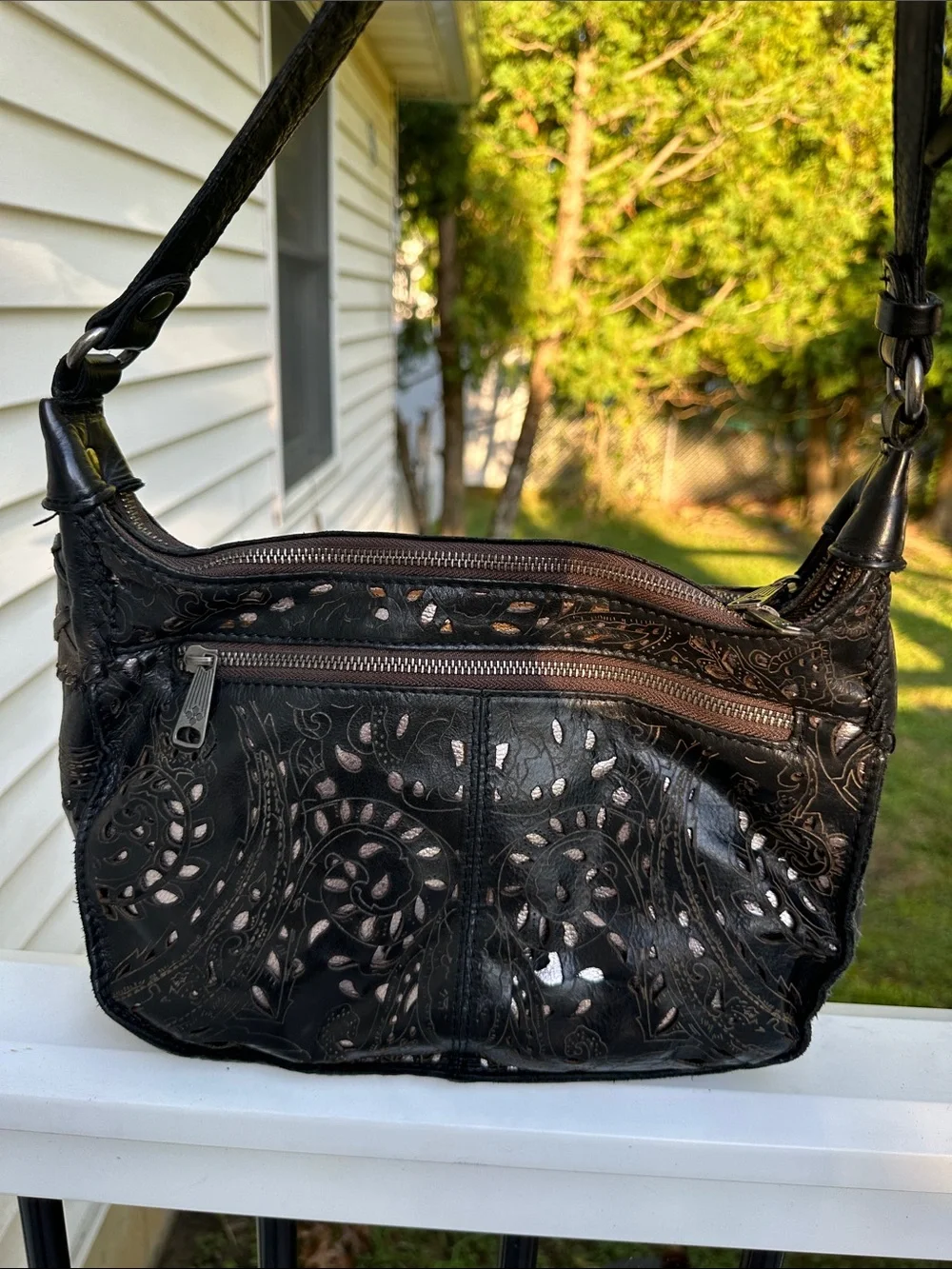 Patricia Nash Black Floral Cutout Crossbody with Tassel Accent
